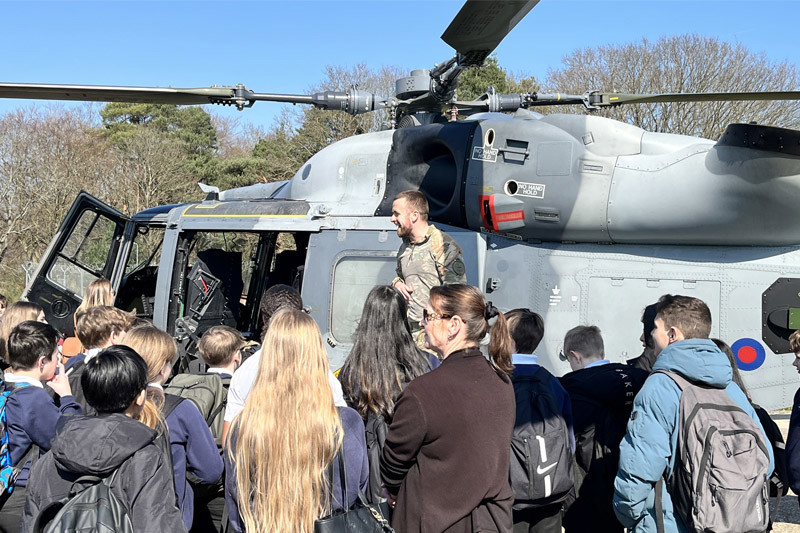 Military Helicopter With Children Around It