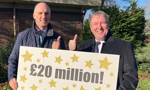 Leo Docherty - MP for the Aldershot, and Councillor David Clifford - Leader of Rushmoor Borough Council, holding up a banner welcoming the news that Rushmoor has secured £20 million from the government’s Levelling Up Fund.