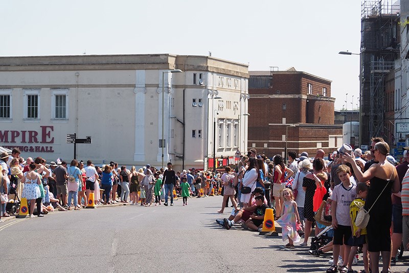 Crowds Looking Down The High Street