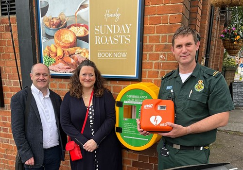 The Leader of Rushmoor Borough Council, Councillor Gareth Williams, and fellow Empress ward representative, Councillor Julie Hall, at the Alexandra pub with Paramedic and Manager of the Community First Responders, Richard Taylor.