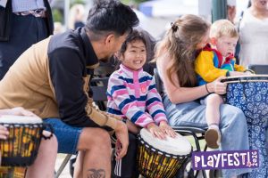 Children playing with drums